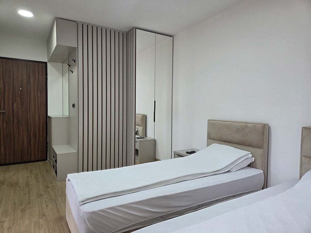 Spavaći deo i garderober u Apartmanu 38