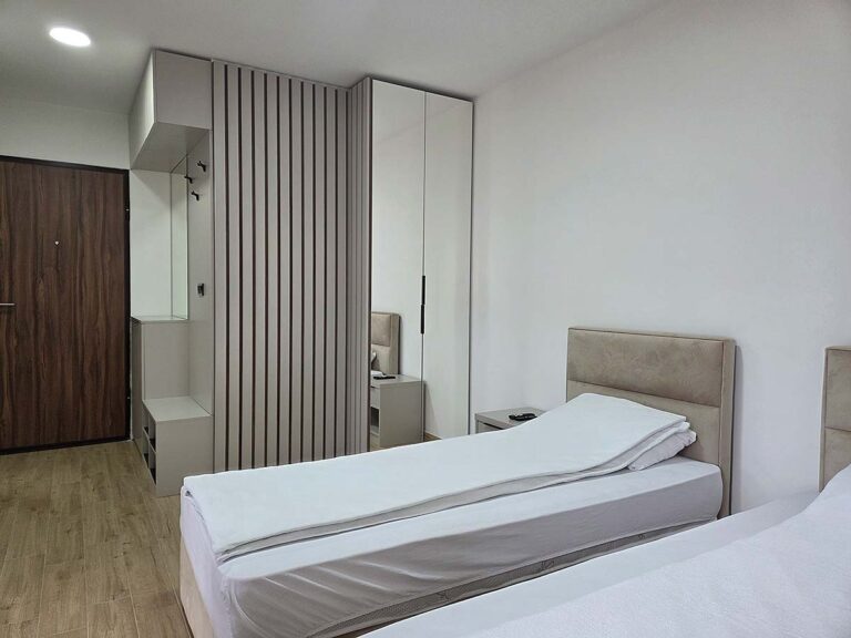 Spavaći deo i garderober u Apartmanu 38